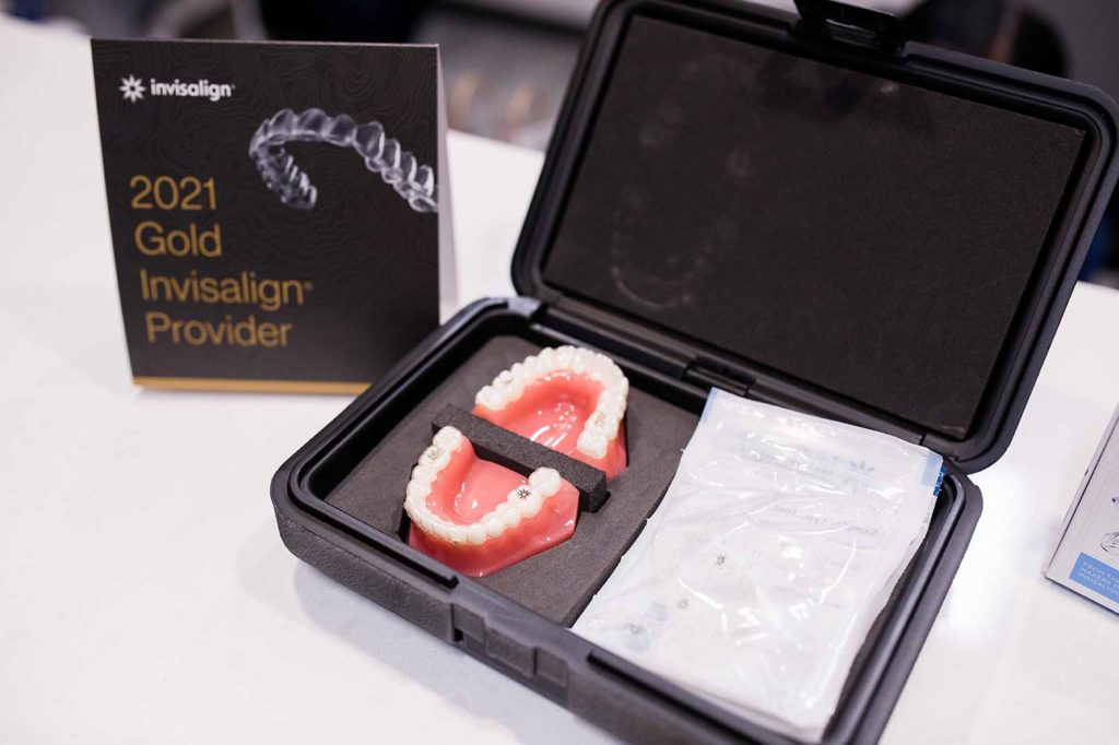 invisalign kit with a set of fake teeth in a box
