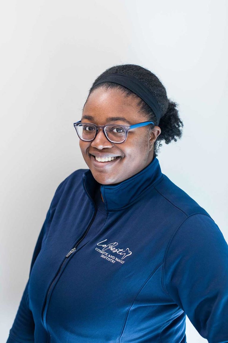 team member sydney smiling
