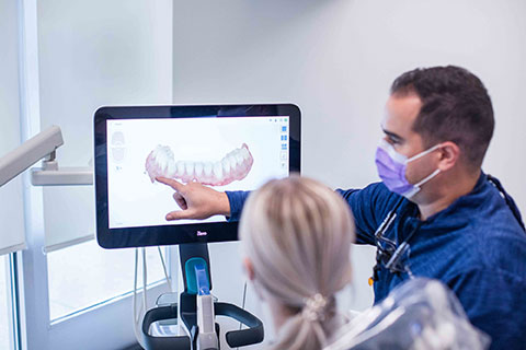 dr lopresti of lopresti cosmetic and family dentistry showing patient an xray